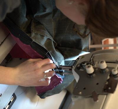Student sewing a bag