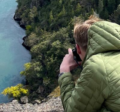 Alex photographs a body of water in Patagonia