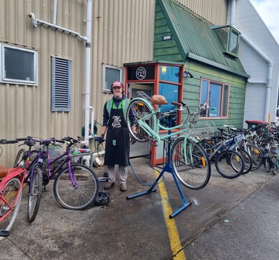 Anders holding a bike at his internship