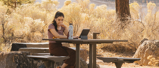 OSU-Cascade's student working at a picnic table