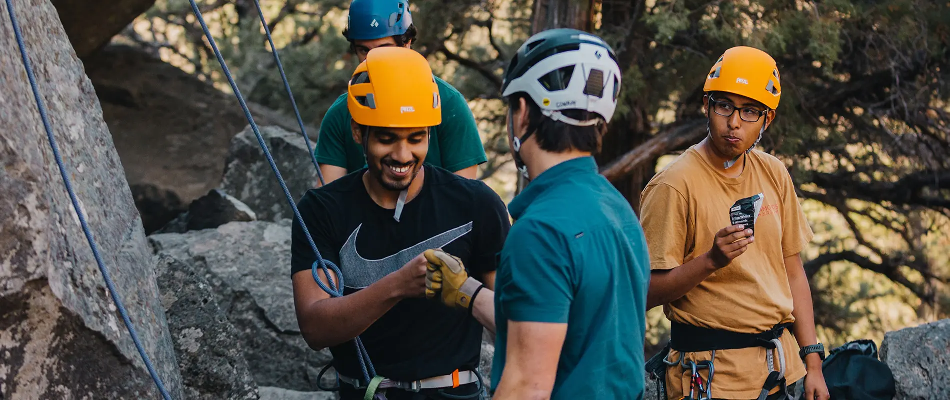 Students in the climbing club fist bump at Smith Rock.