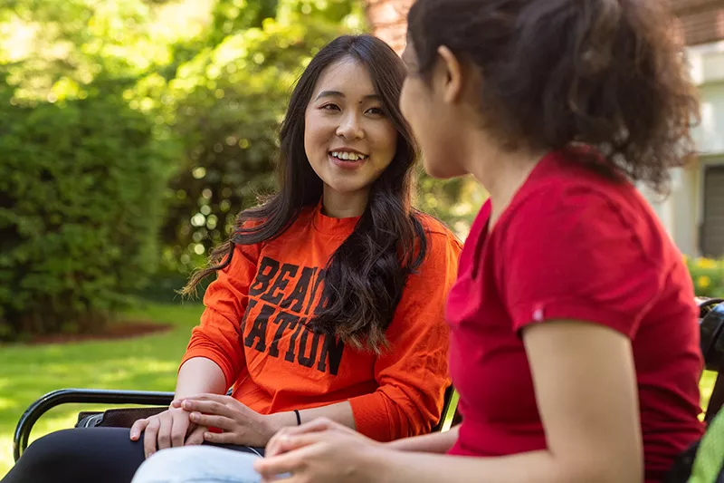 Students sitting on a bench