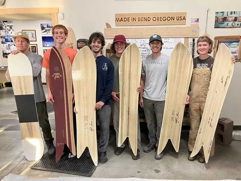 Students holding Snoplanks boards