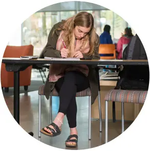 OSU-Cascades student working at a desk