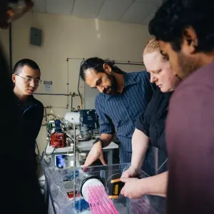 OSU students and professor in an engineering science lab