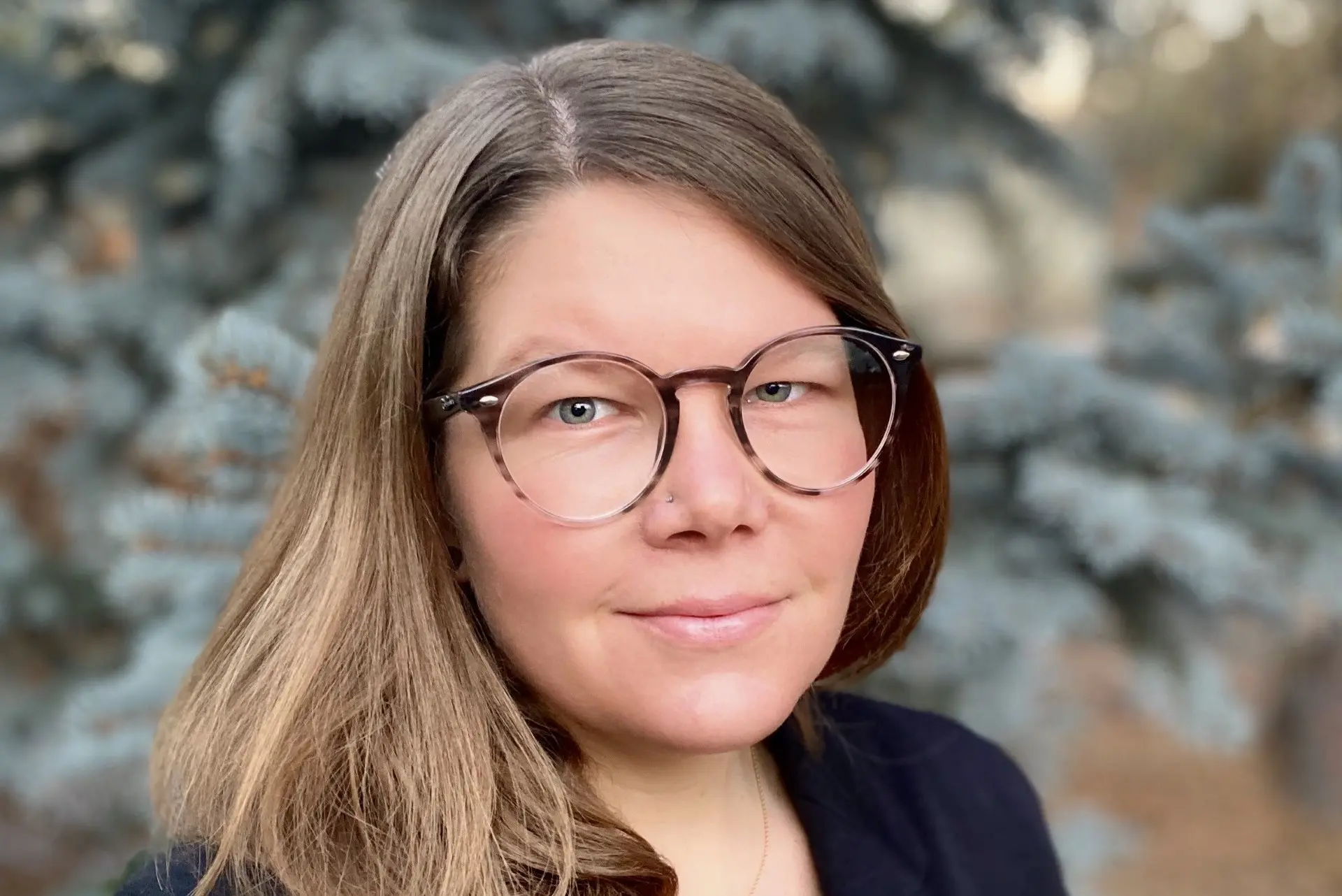 Headshot of a woman with glasses
