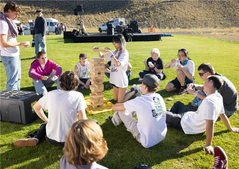 Student carnival games where students play giant Jenga game.