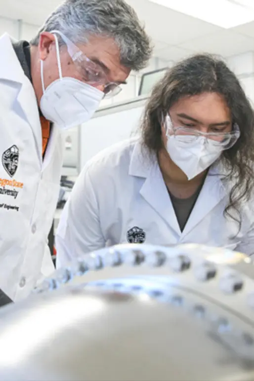 OSU people in lab coats working