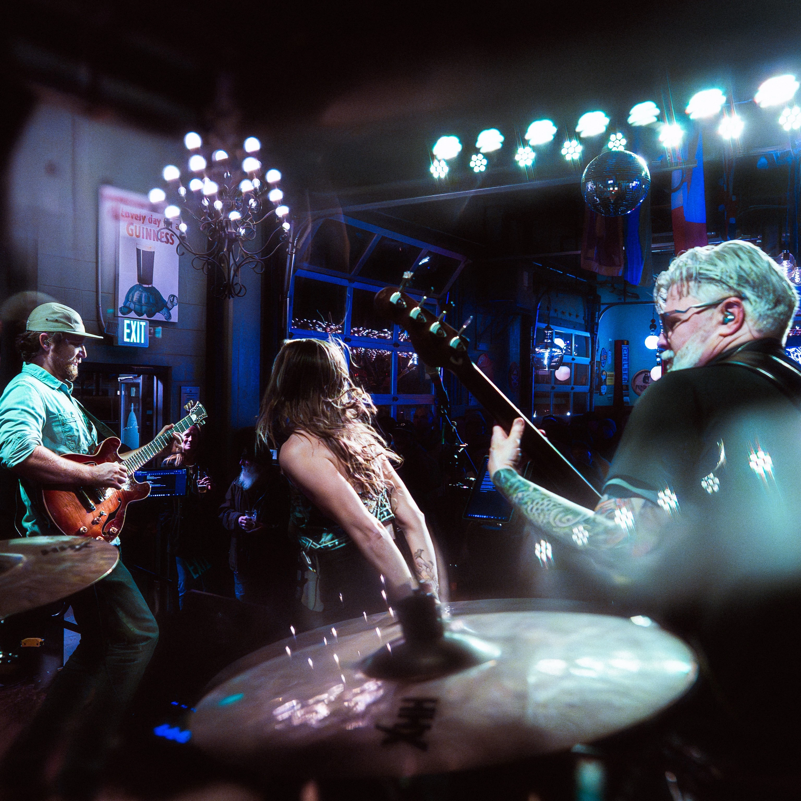 Funk Around and Find Out performing to an indoor crowd.