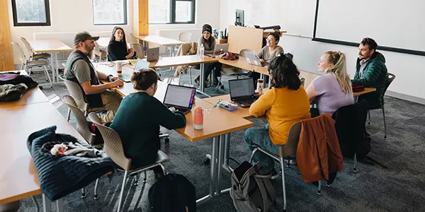 MFA faculty in class with students