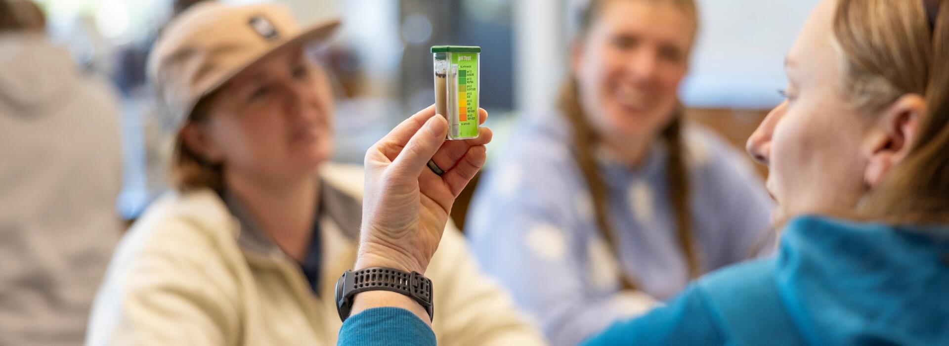 Person holding a soil sample