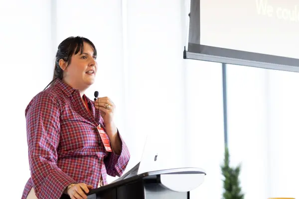 Mary Weedman Lorish speaking behind a podium