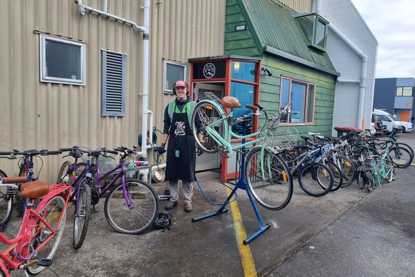 Anders holding a bike at his internship