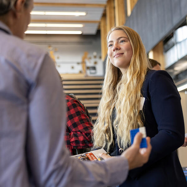 Female student with employer at career fair
