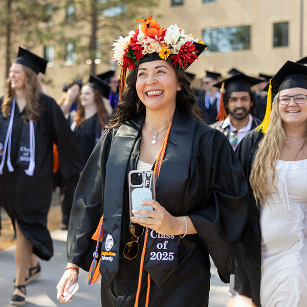 smiling graduate in regalia