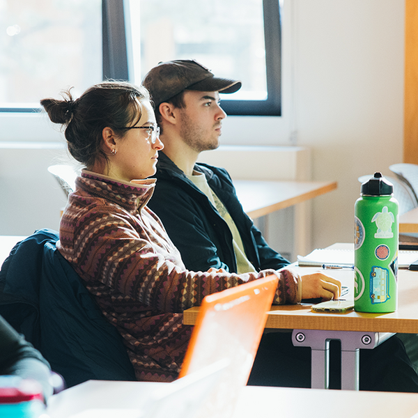 Two students sitting in classroom