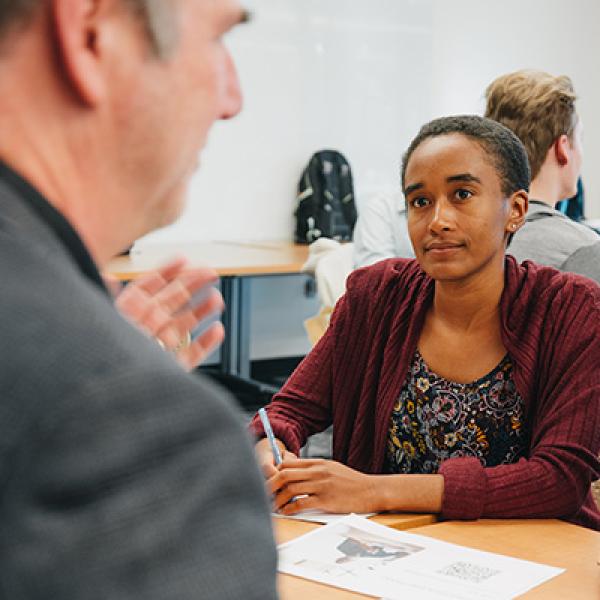 A student talking to an employer