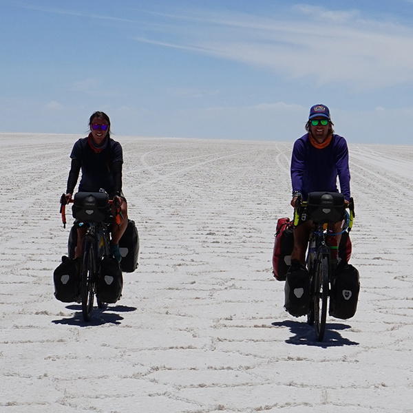 Kristen Jokinen and her husband, Ville, cycling across desert landscape.